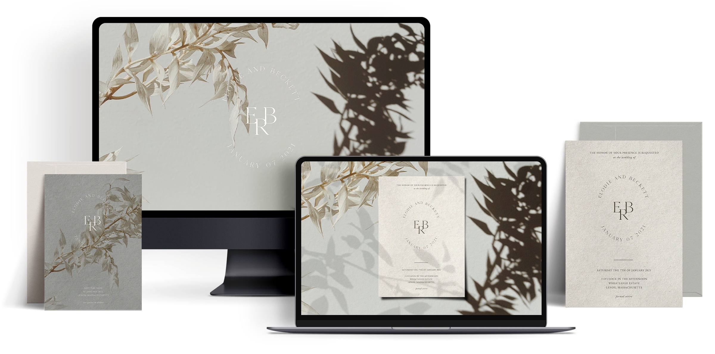 A monitor and laptop screen showing a floral wedding website and online invitation, and matching printed wedding invitations