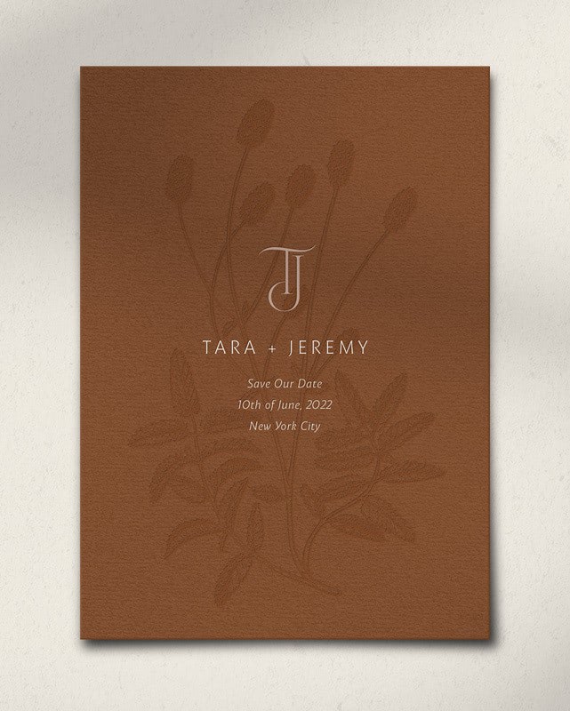 A brown Save the Date with a botanical accent for a couple named Tara and Jeremy